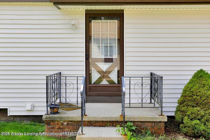 Property Photo:  508 Red Cedar Boulevard  MI 48895 