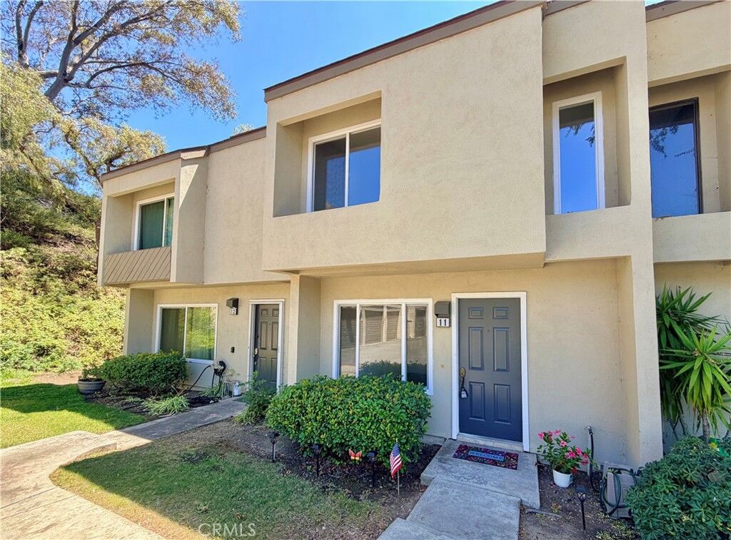 Property Photo: 245 N Singingwood Street 11 CA 92869