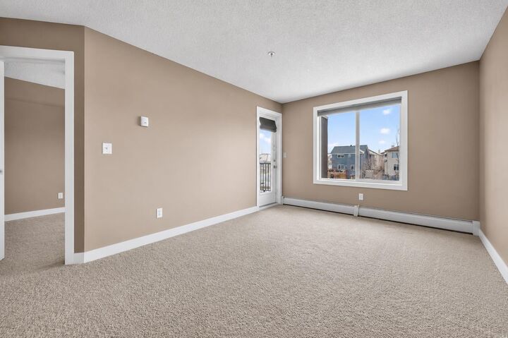 Property Photo:  403 Mackenzie Way SW 4317  AB T4B 3V7 