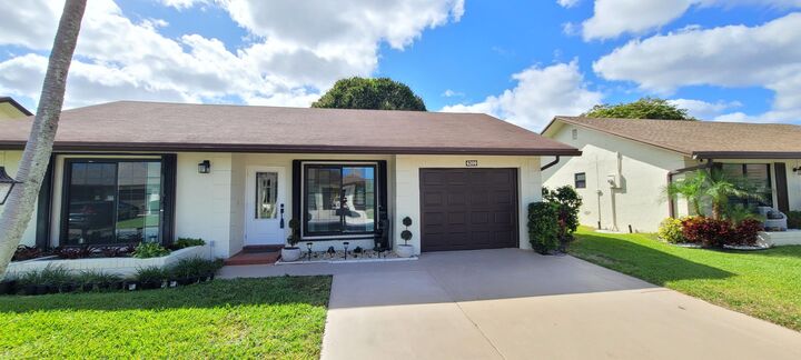 Property Photo:  6209 Olivewood Circle  FL 33463 