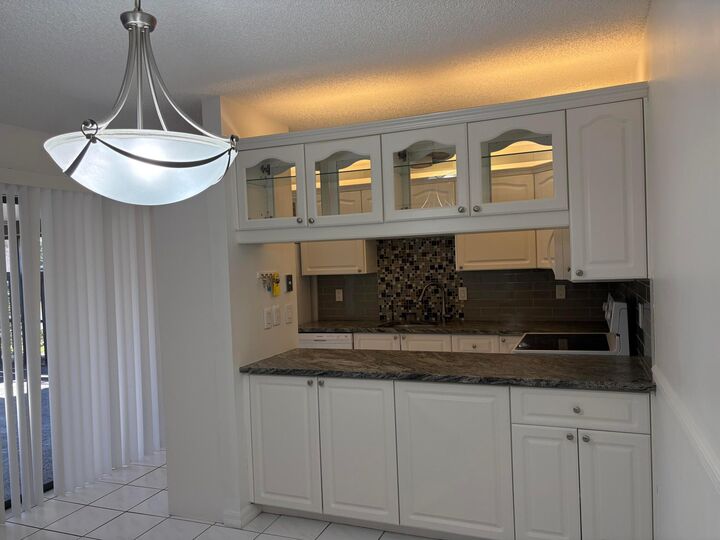 Property Photo:  203 SE Camelot Gardens Boulevard C  FL 34952 