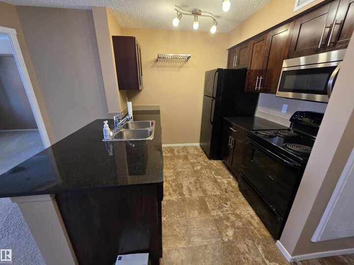 Property Photo: 5816 Mullen Place NW 319 AB T6R 0W3