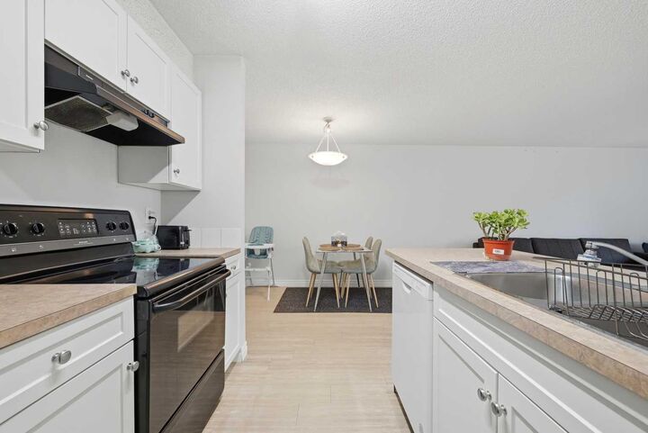 Property Photo: 5555 Falsbridge Drive NE 111 AB T3J 3E8