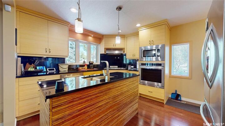 Property Photo:  3307/3309 Dawson Crescent  SK S4R 3V6 