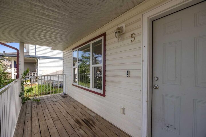 Property Photo: 100 St. Laurent Way 5 AB T9K 2R4