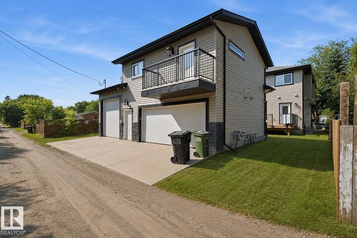 Property Photo:  10707-09 128 Avenue NW  AB T5E 0J4 