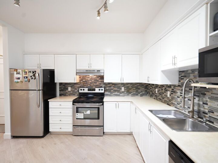 Property Photo: 8139 121A Street 115 BC V3W 0Z2