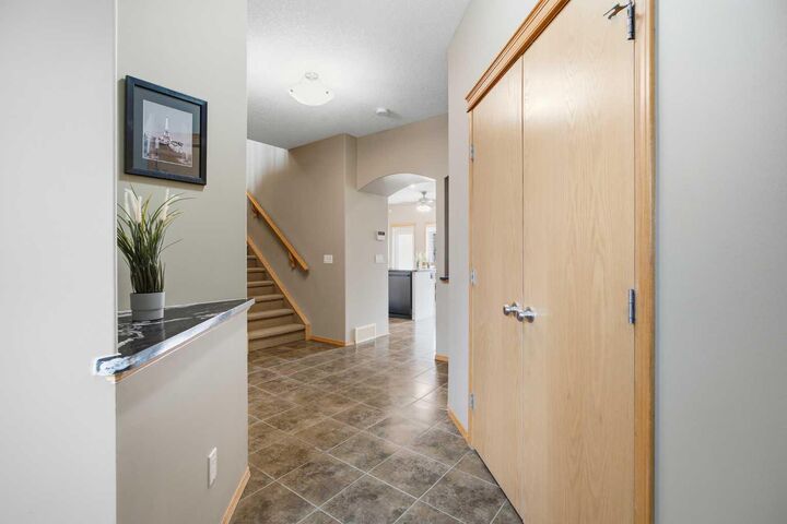 Property Photo:  100 Coopers Common SW 126  AB T4B 3C7 