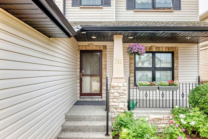 Property Photo: 311 Rocky Ridge Drive NW AB T3G 4P4