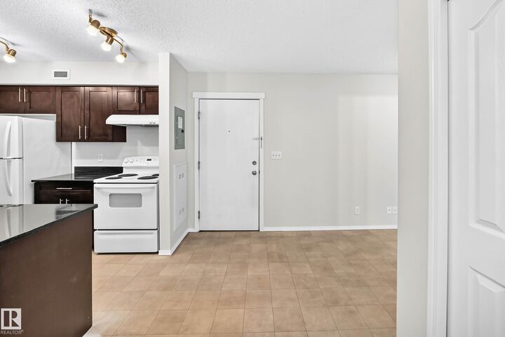 Property Photo:  12025 22 Avenue SW 404  AB T6W 2Y1 