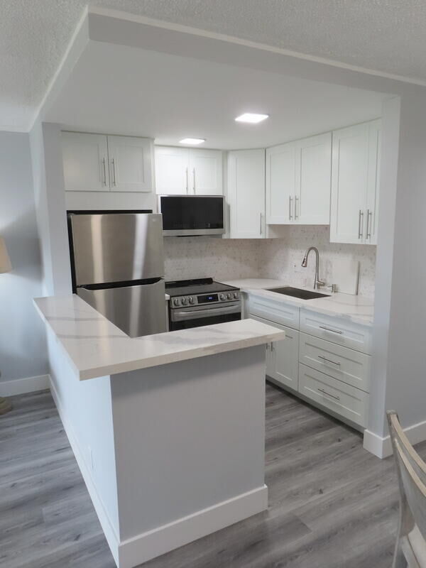Property Photo:  101 Hastings G  FL 33417 