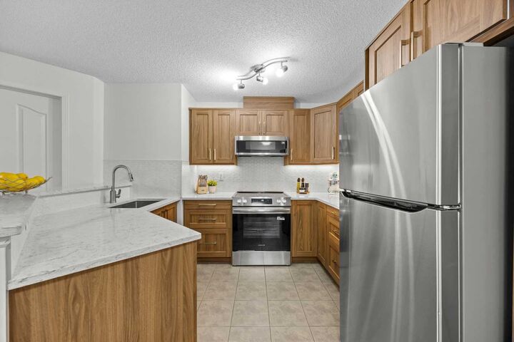 Property Photo:  16969 24 Street SW 5210  AB T2Y 0J8 