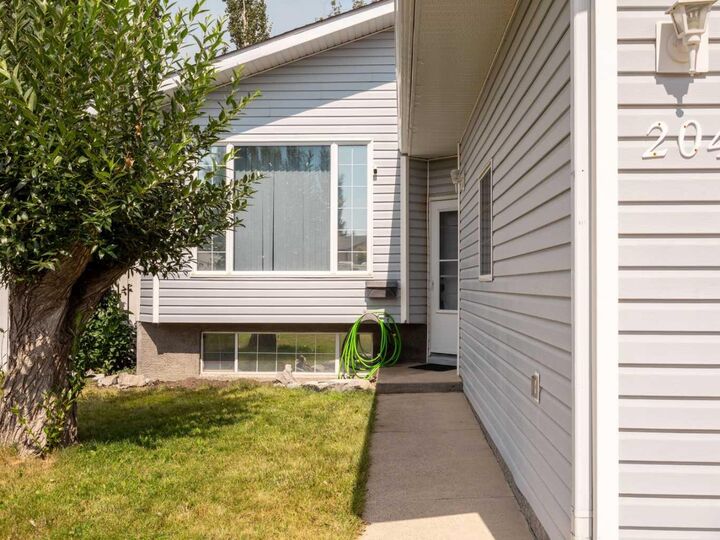 Property Photo: 204 Mt Rundle Road W AB T1K 7E9