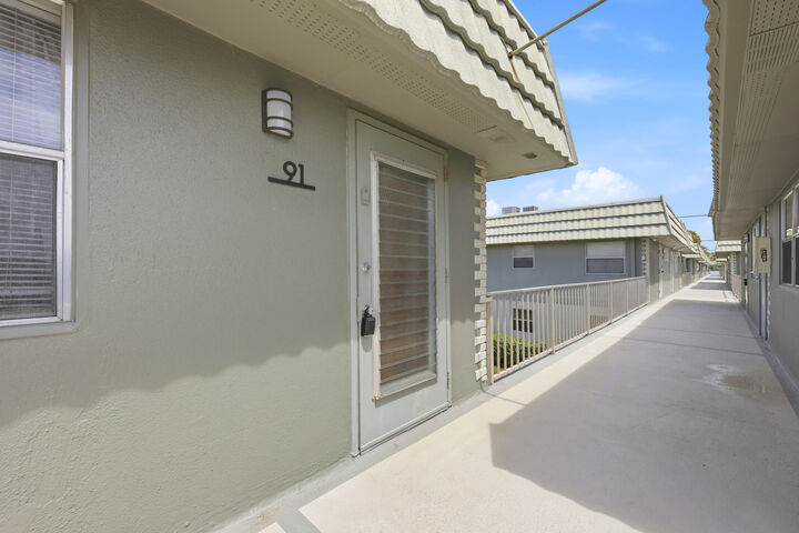 Property Photo:  91 Flanders B  FL 33484 