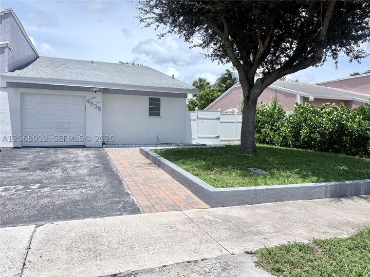 Property Photo:  4835 NW 6th Ct  FL 33445 