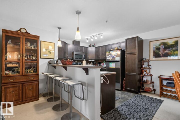 Property Photo:  7909 71 Street NW 210  AB T6B 3P5 
