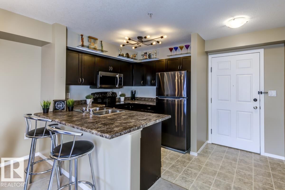 Property Photo:  42 Summerwood Boulevard 220  AB T8H 0C3 