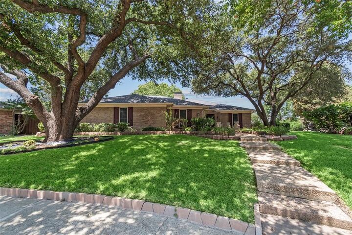 Property Photo: 3233 Chimneyrock Drive TX 75023