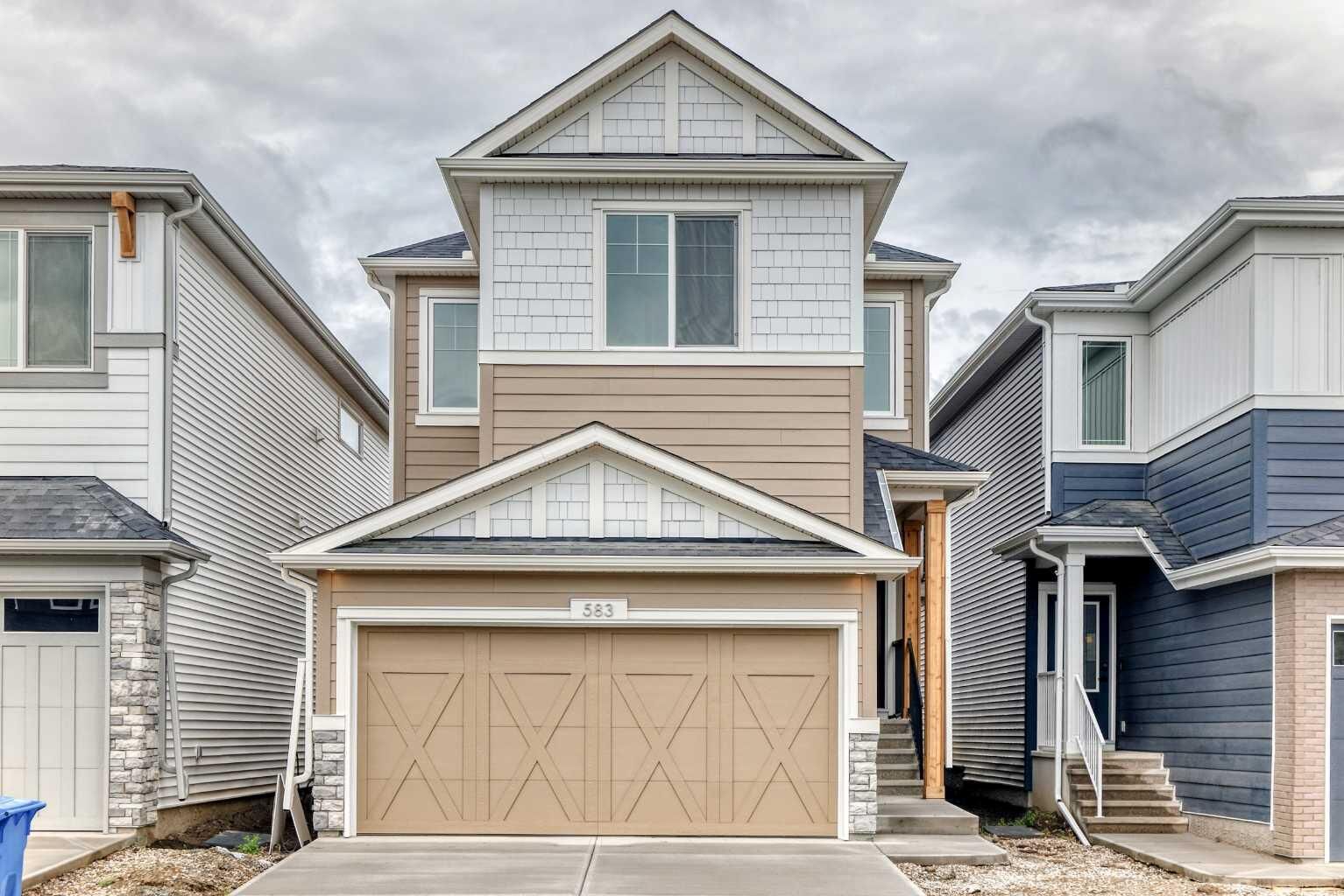 Property Photo: 583 Buffaloberry Manor SE AB T3M 3Z1