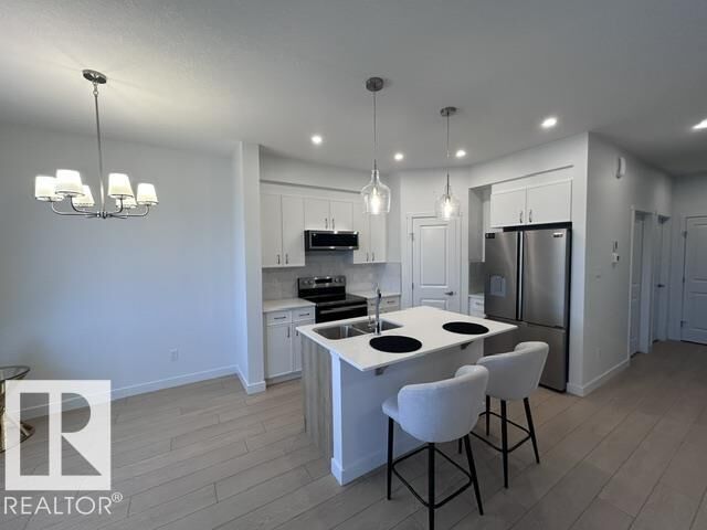 Property Photo: 20936 16 Av NW AB T6M 3J4