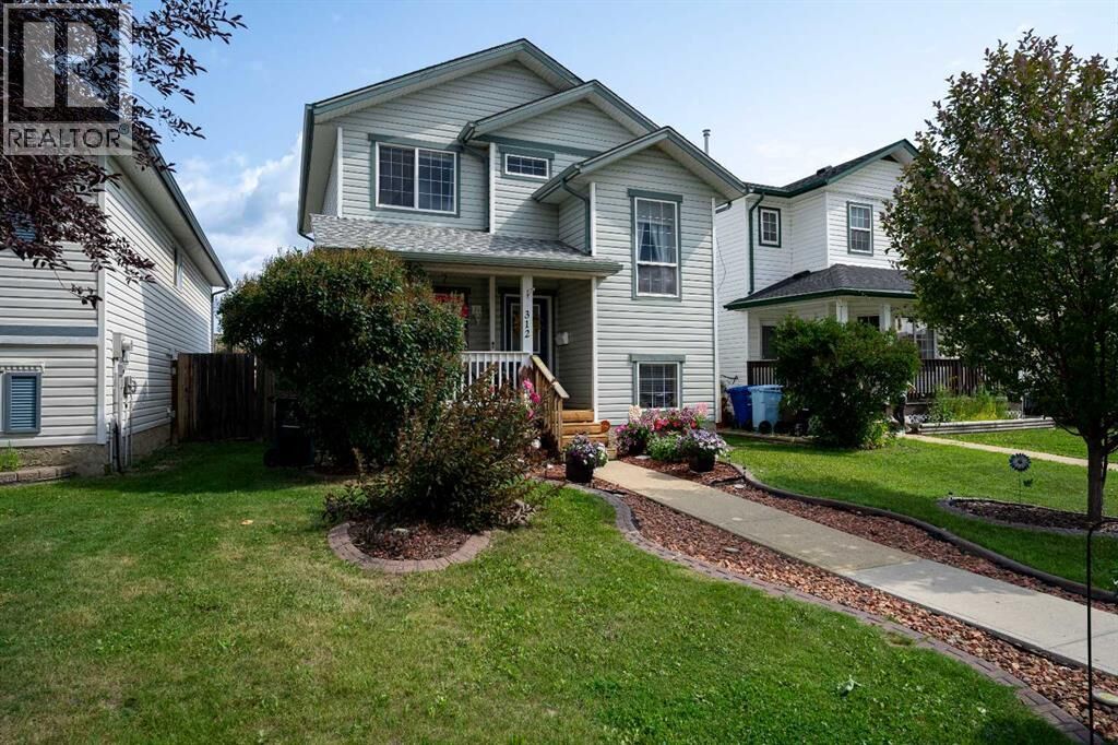 Property Photo:  312 Diefenbaker Drive  AB T9K 2K1 