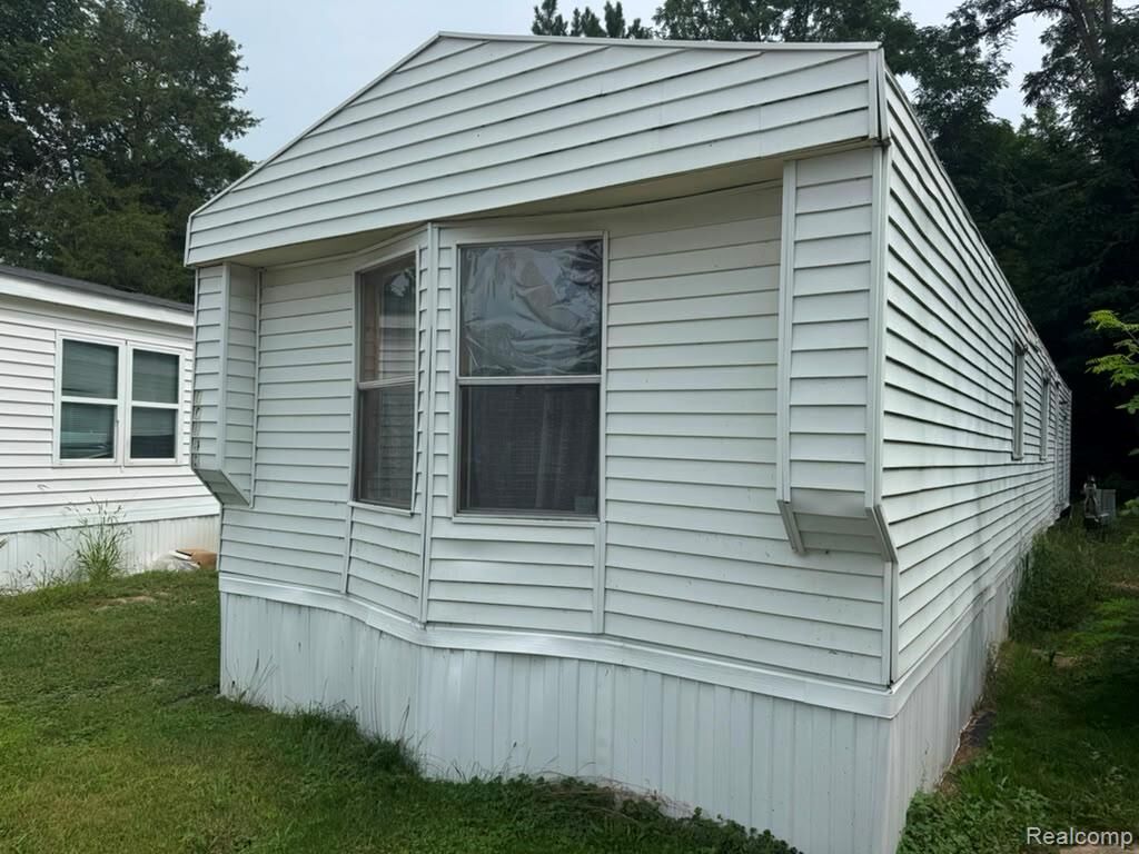 Property Photo:  926 Hill St Lot #18  MI 48875 1563 