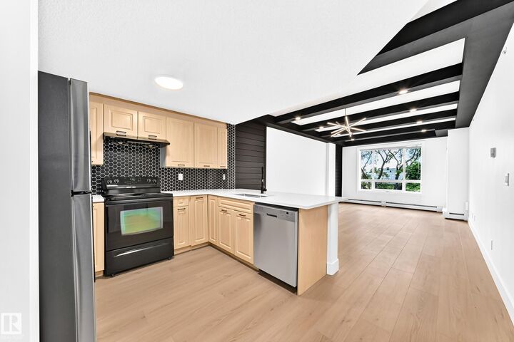 Property Photo:  6315 135 Avenue NW 323  AB T5A 5J7 