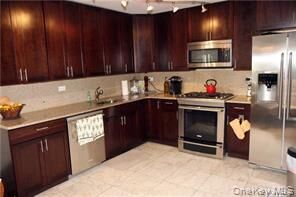Property Photo: 18-05 215 Street 11 K NY 11360