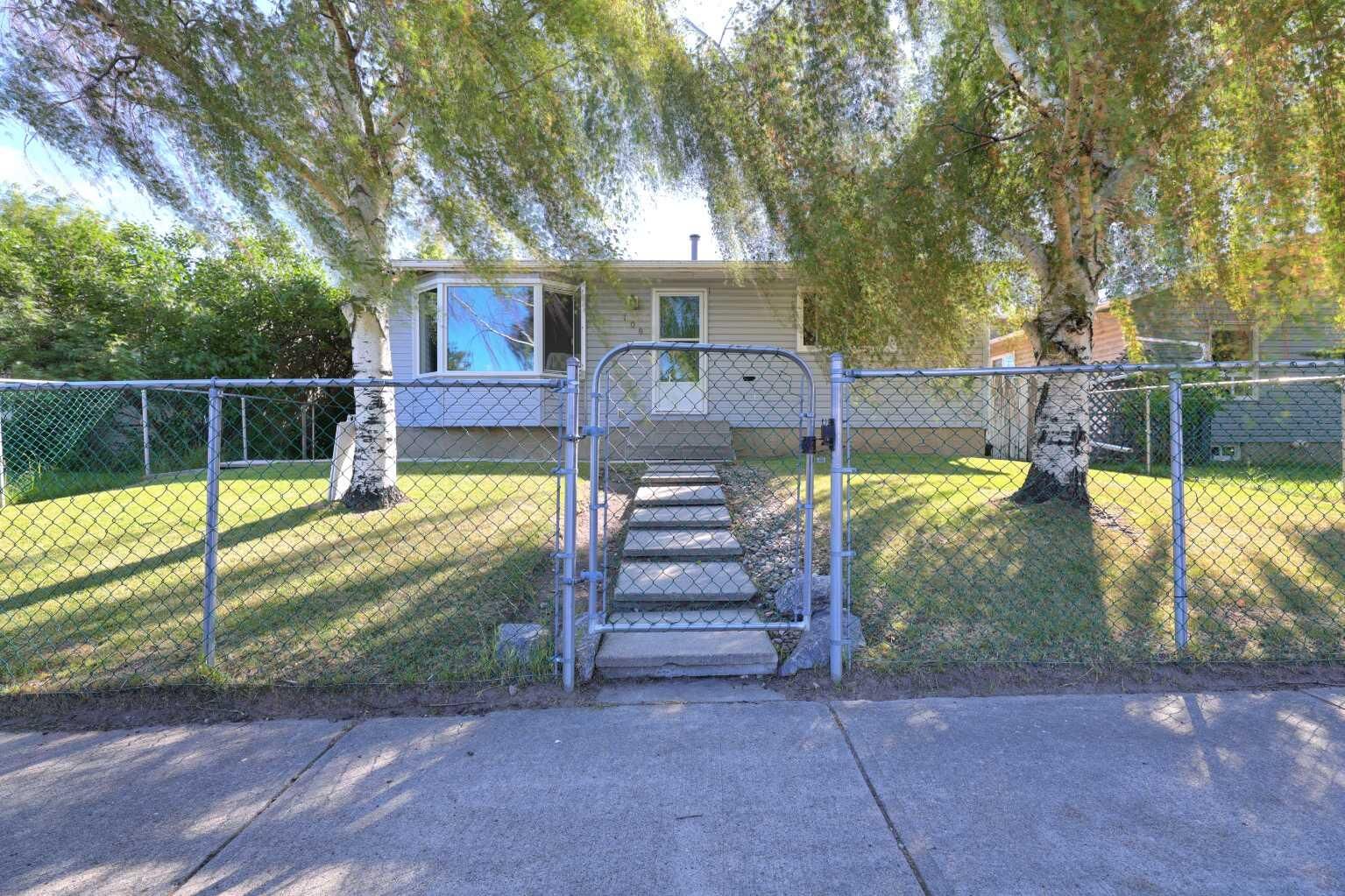Property Photo: 108 Pinecliff Way NE AB T1Y 3X3