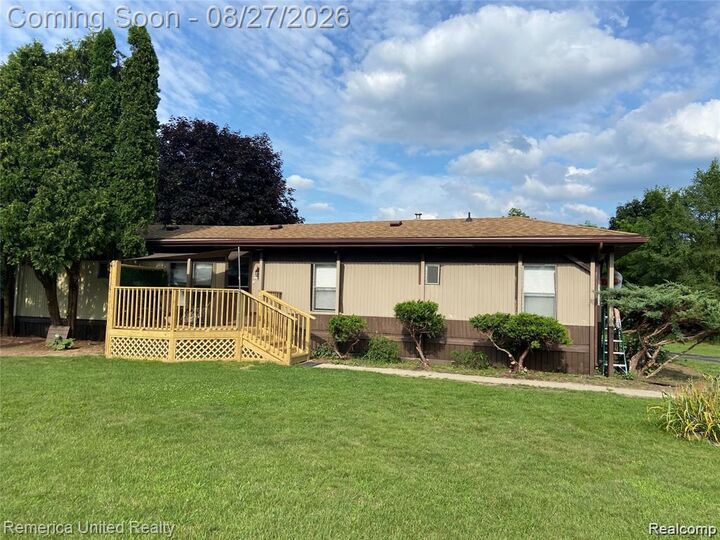 Property Photo:  679 Menominee Drive  MI 48843 