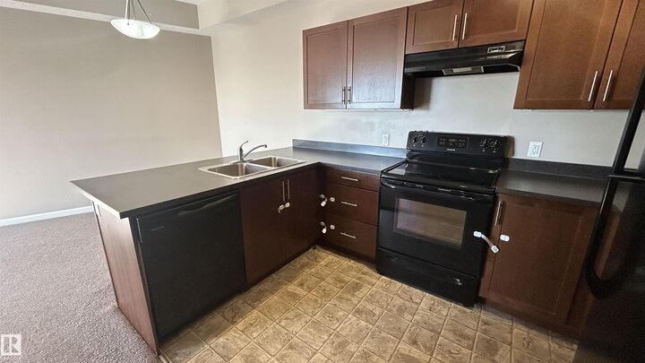 Property Photo: 5302 51 Street 305 AB T9N 2E3