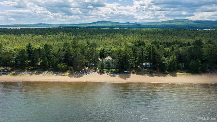 Property Photo:  3702 W Squaw Beach Road  MI 49808 