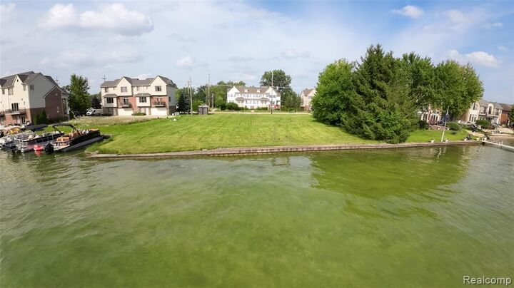 Property Photo:  1540 Cass Lake Road  MI 48320 1007 