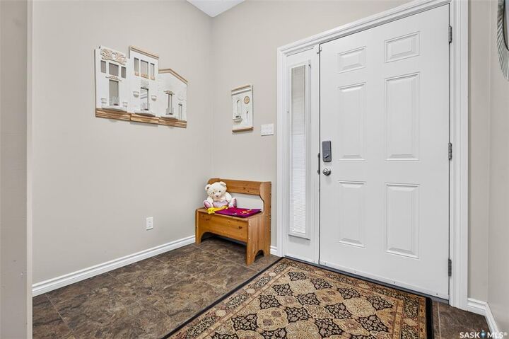 Property Photo:  33 Wood Lily Drive A2  SK S6J 1B4 