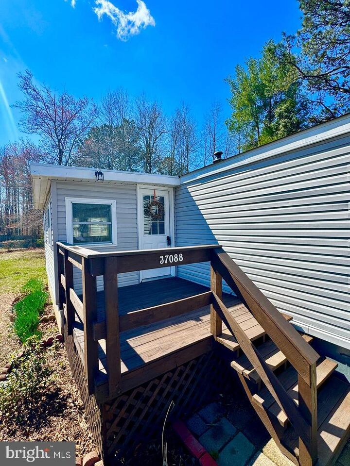 Property Photo: 37088 E White Tail Drive DE 19975