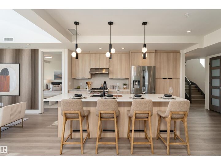 Property Photo:  #401 1350 Windermere Wy SW  AB T6W 2J3 