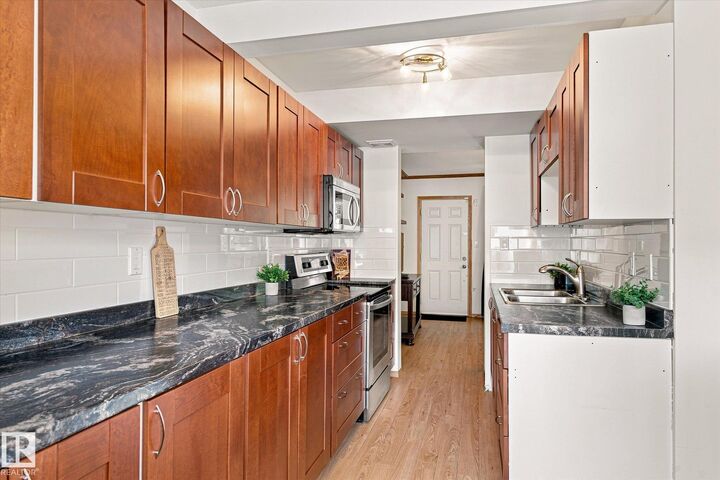 Property Photo:  790 Abbottsfield Road NW  AB T5W 4R4 