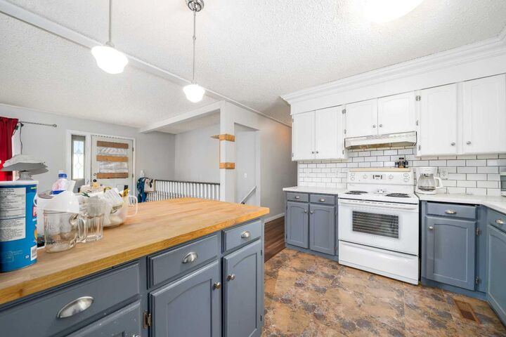 Property Photo:  190014 12 Street W 2  AB T1R 1C7 