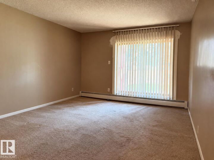 Property Photo: 11608 28 Avenue NW 2 AB T6J 4E3