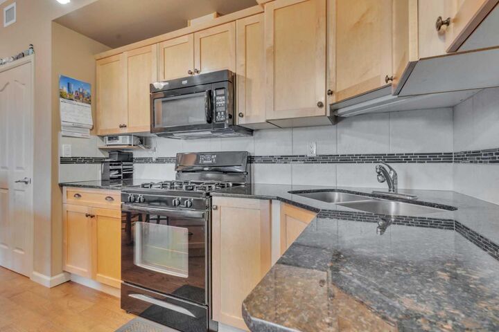 Property Photo:  5040 53 Street 412  AB T4A 0A1 