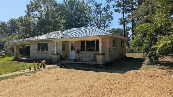 Property Photo:  103 E First  AR 72128 