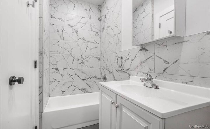 Property Photo:  90-11 77th Street 1  NY 11421 
