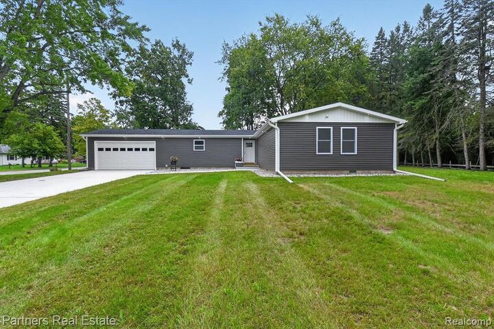 Property Photo: 204 Greenfield Drive MI 48858 2946