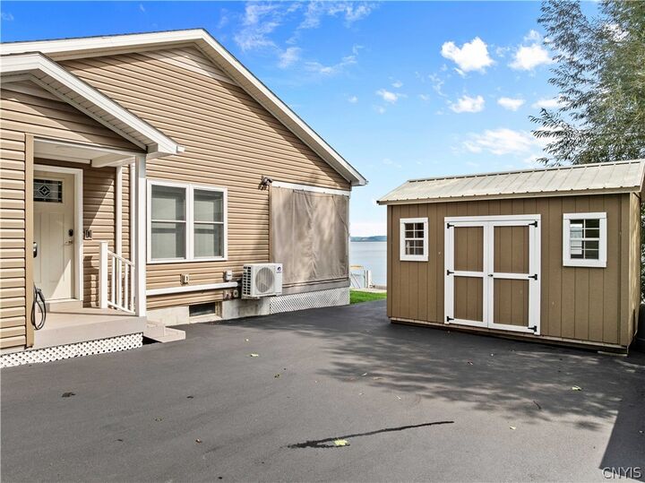 Property Photo:  14900 W Bay Road  NY 13156 