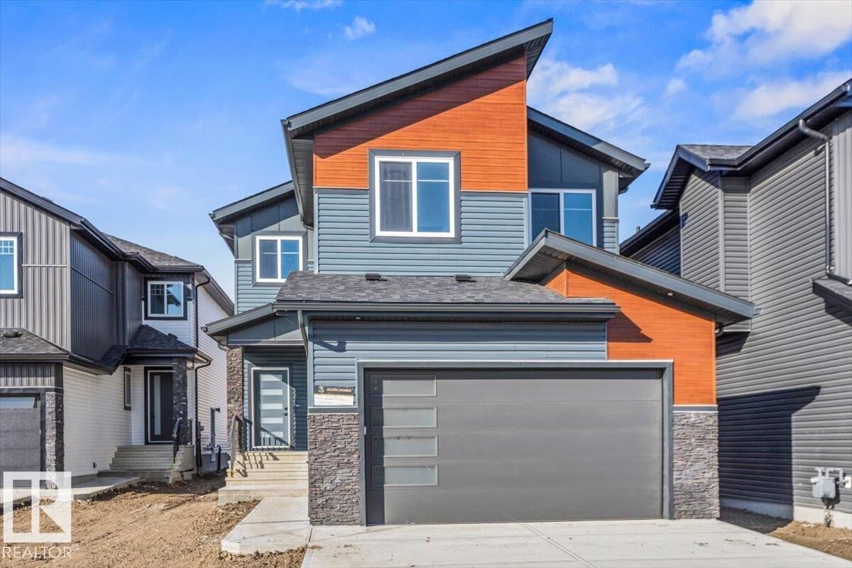 Property Photo: 6 Owl Ridge Close AB T8L 1Y4