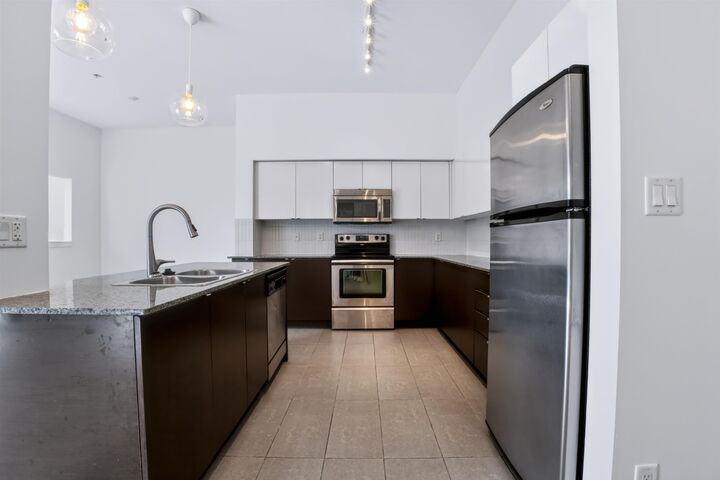 Property Photo:  13733 107A Avenue 523  BC V3T 0B7 