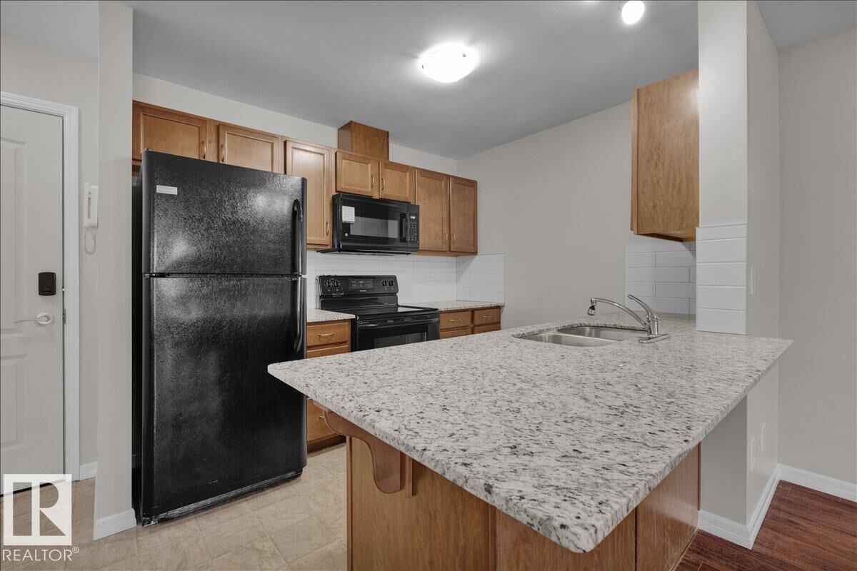 Property Photo:  271 Charlotte Way 319  AB T8H 0N9 
