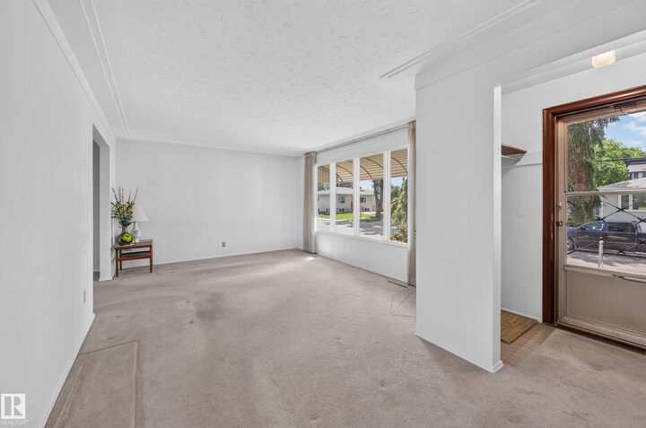 Property Photo:  7704 104 Avenue NW  AB T6A 0Y3 