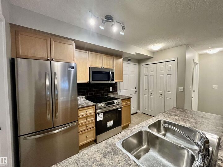 Property Photo:  6921 199 Street NW 102  AB T5T 3X7 