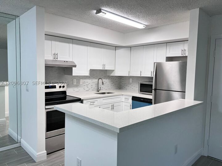 Property Photo:  19055 NW 62nd Ave 111  FL 33015 